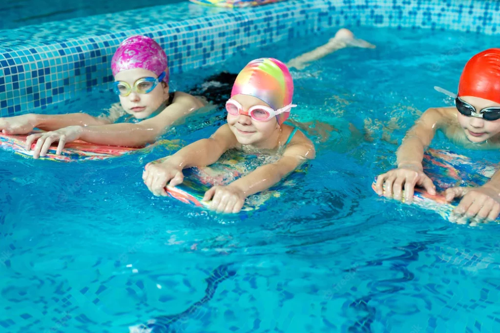 group-boys-girls-train-learn-swim-pool-with-instructor_199620-11812